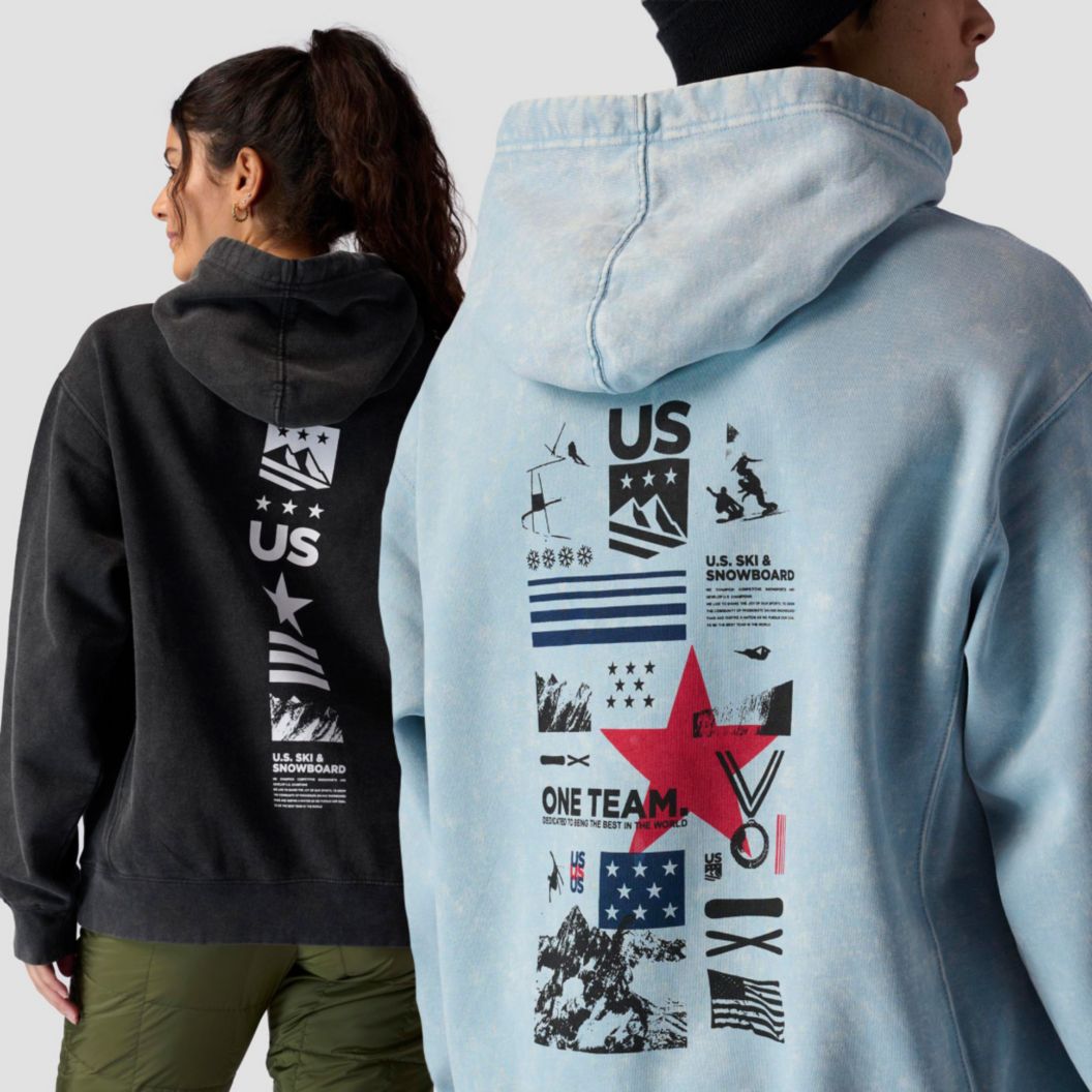 Two models show off new U.S. Ski & Snowboard hoodies. The upper right-hand corner shows off the teams’ logo along with their sponsor, VISA. 