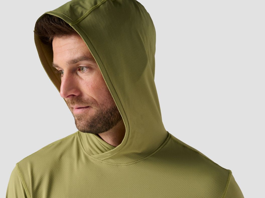 A model wearing a green Tahoe hoodie.