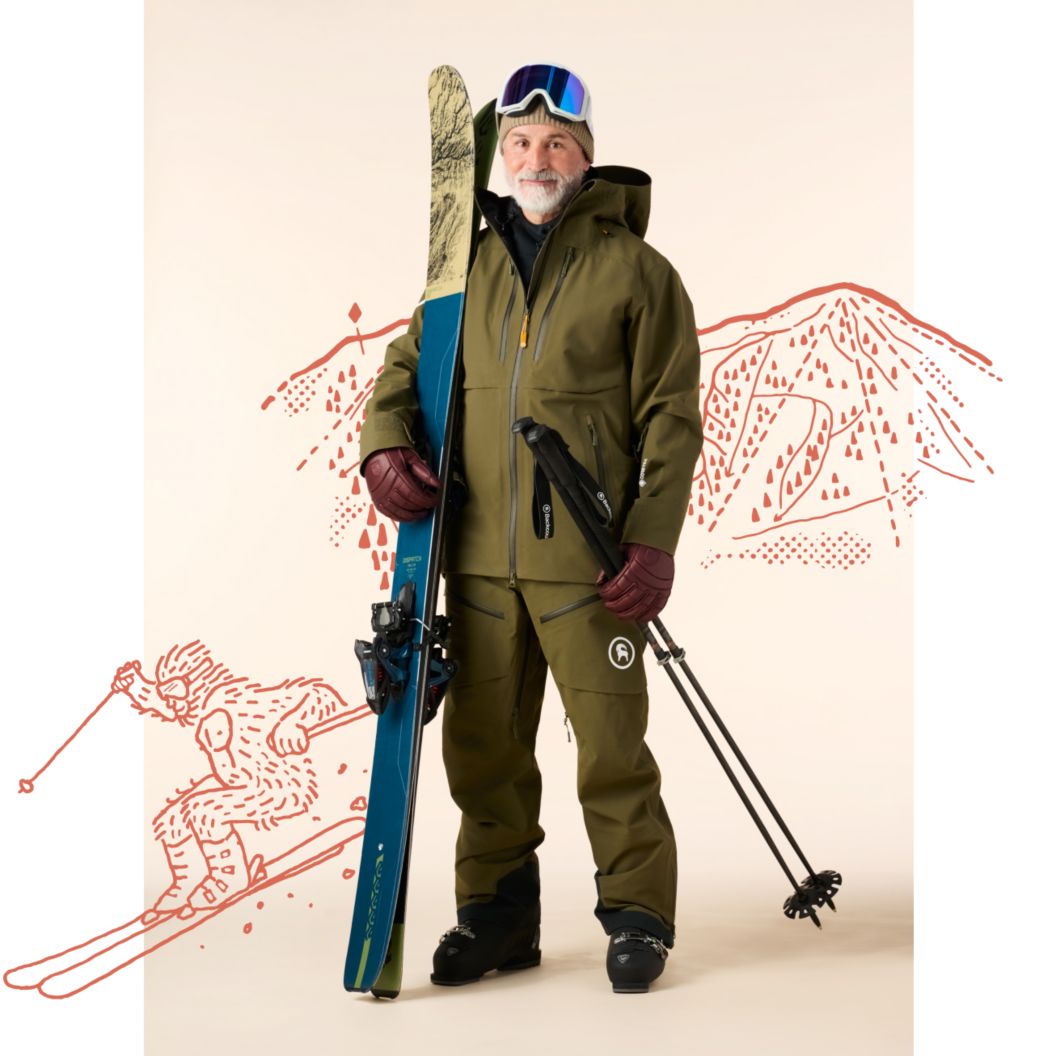 A skier in a green snow kit carries twin tip skis and adjustable poles. Behind him are illustrations of a ski resort and a yeti carving turns. 