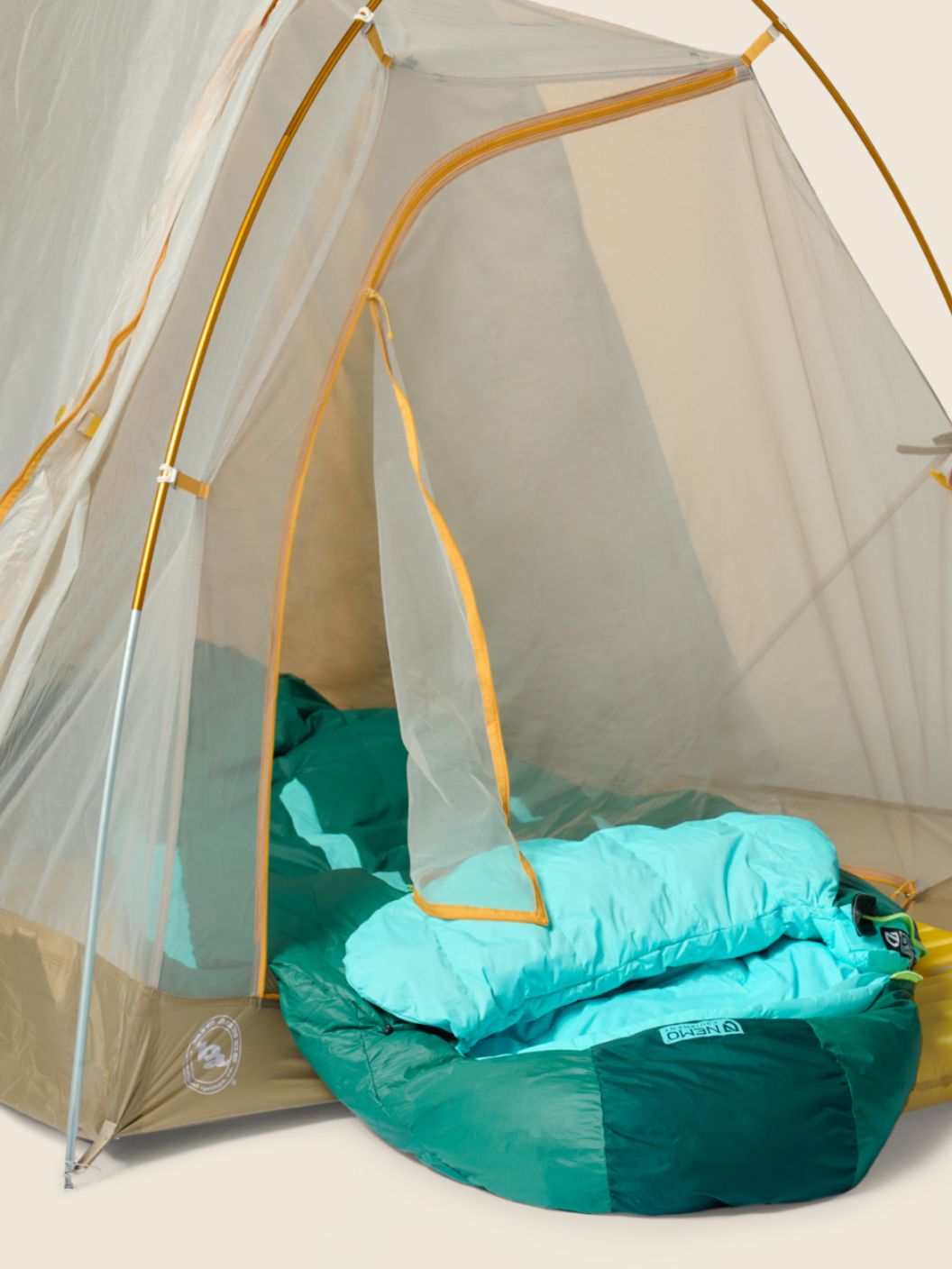 A sleeping bag inside of a tent.