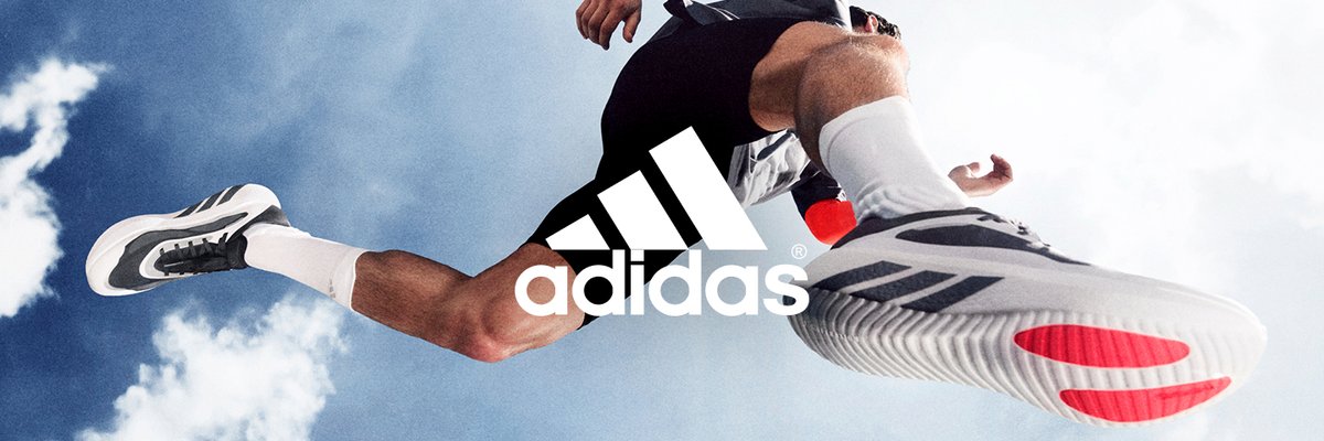 Runner airborne in Adidas Hyperboost Edge shoes shot from below against a cloudy sky, featuring the Adidas logo.