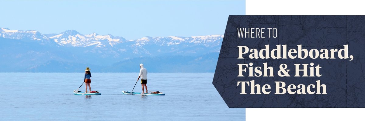 A man and a woman paddleboard on a calm lake with distant snow-capped mountains visible in the background. To the right, a dark blue banner features the text: "WHERE TO Paddleboard, Fish & Hit The Beach."