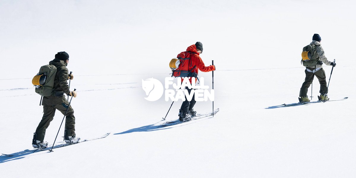 A person climbs a snowy mountain.