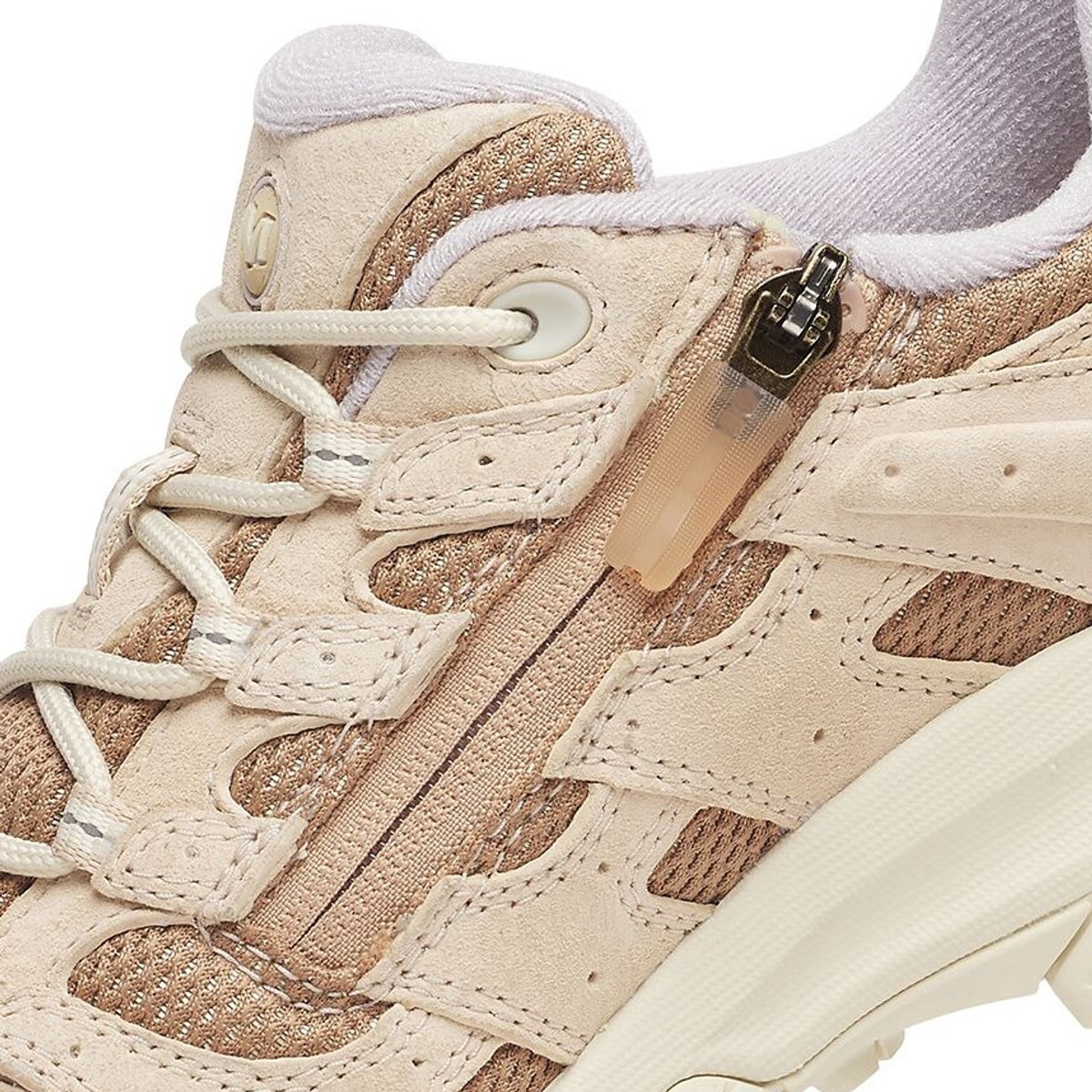 Close-up of the toe medial size zipper on a Merrell hiking shoe.