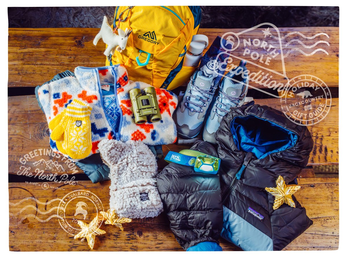 Flat lay of winter gear, including a yellow daypack, fleece, mittens, binoculars, hiking shoes, a headlamp, and a puffy jacket, with “North Pole Expedition” stamps.