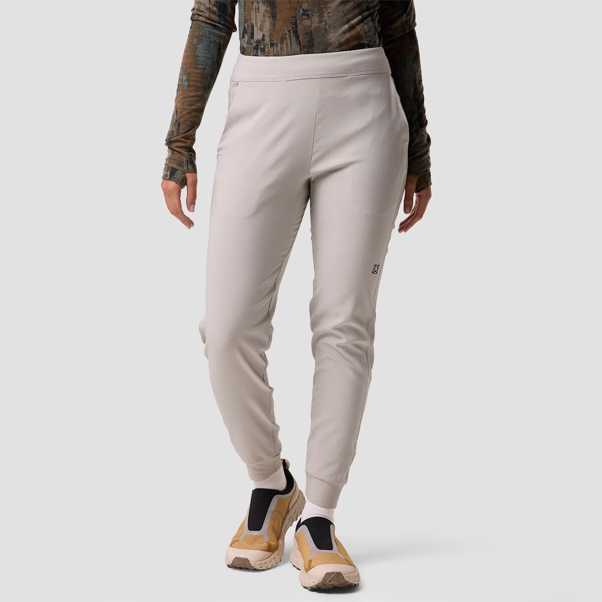 A woman wears the Destination Softshell pant.