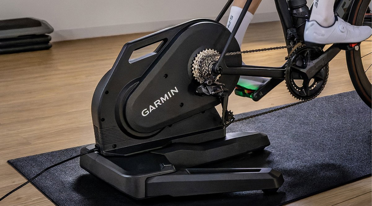 A closeup of the Garmin Tacx Nera Trainer set up in a home gym.