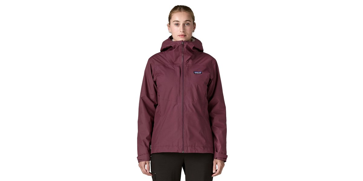 A woman wears the Patagonia Insulated Boulder Fork Rain Jacket