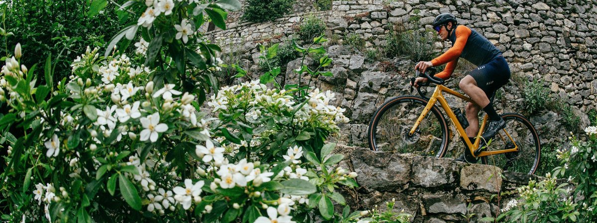Gravel rider exploring rugged hillside on the ENVE MOG carbon bike