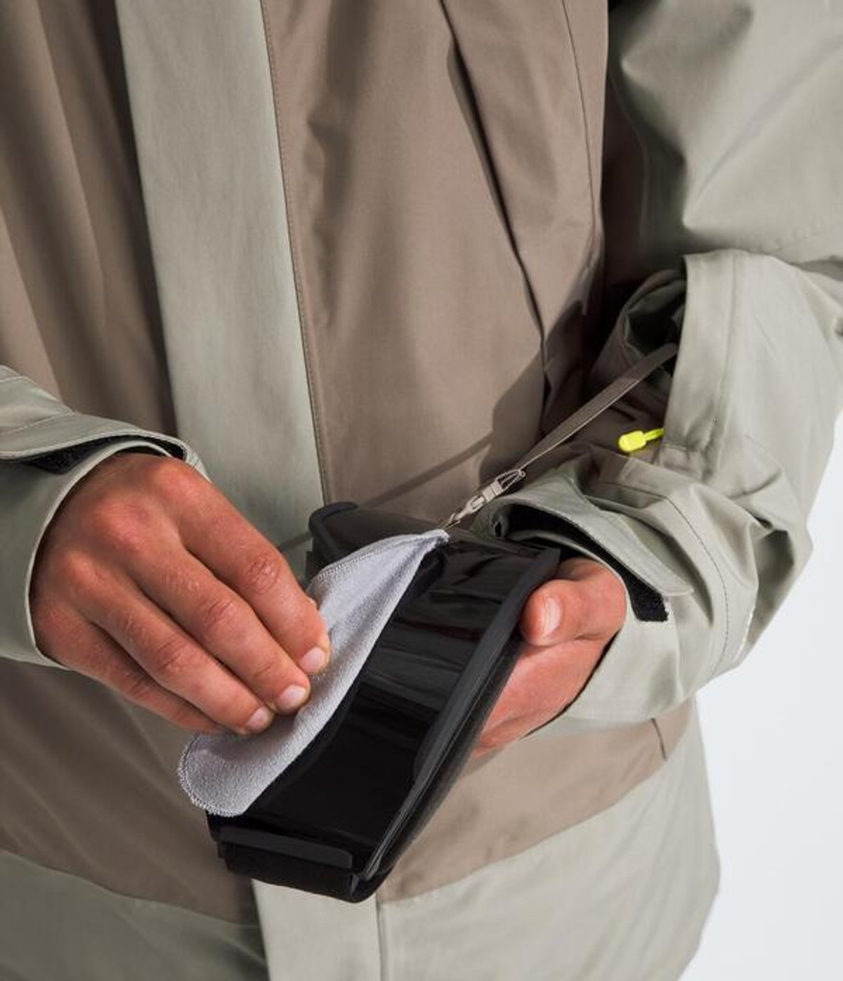 Person using integrated goggle wipe.