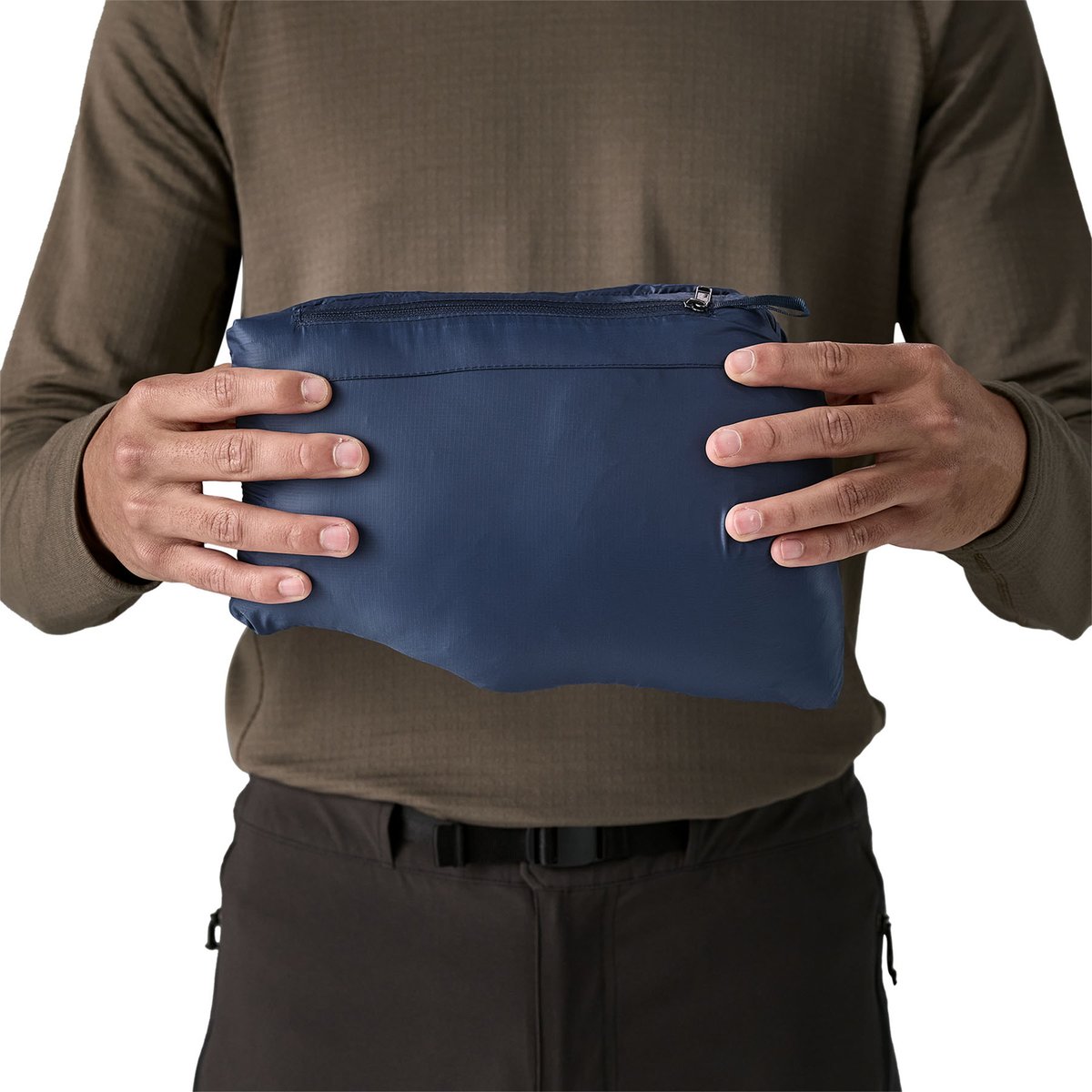 The Patagonia Down Sweater packed neatly into its self-contained pocket
