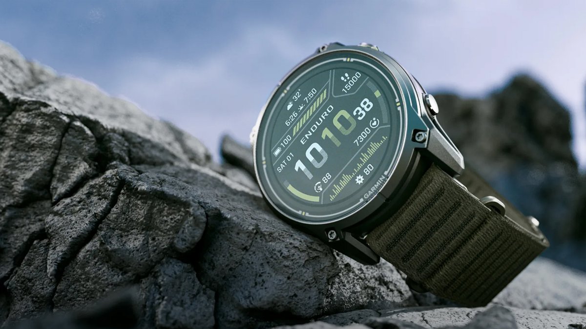 The Garmin Enduro 4 against a rocky outdoor background.