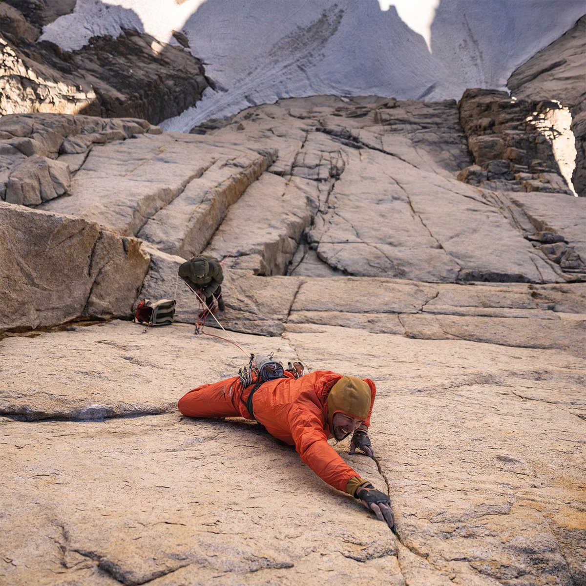 Climber reaching for his next hold.
