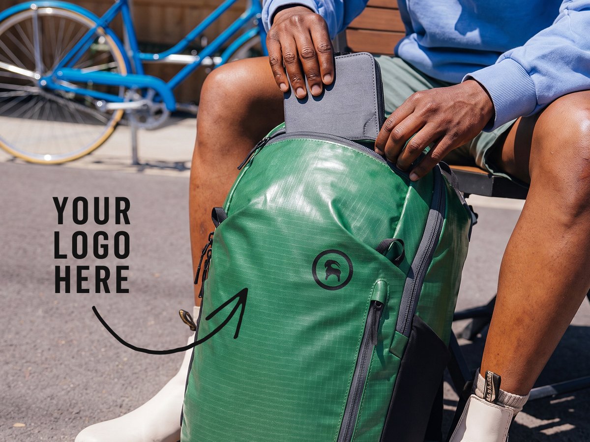 Promotional banner reading "Outfit Your Whole Crew" featuring three models wearing customizable branded workwear from The North Face, YETI, Osprey, and more.