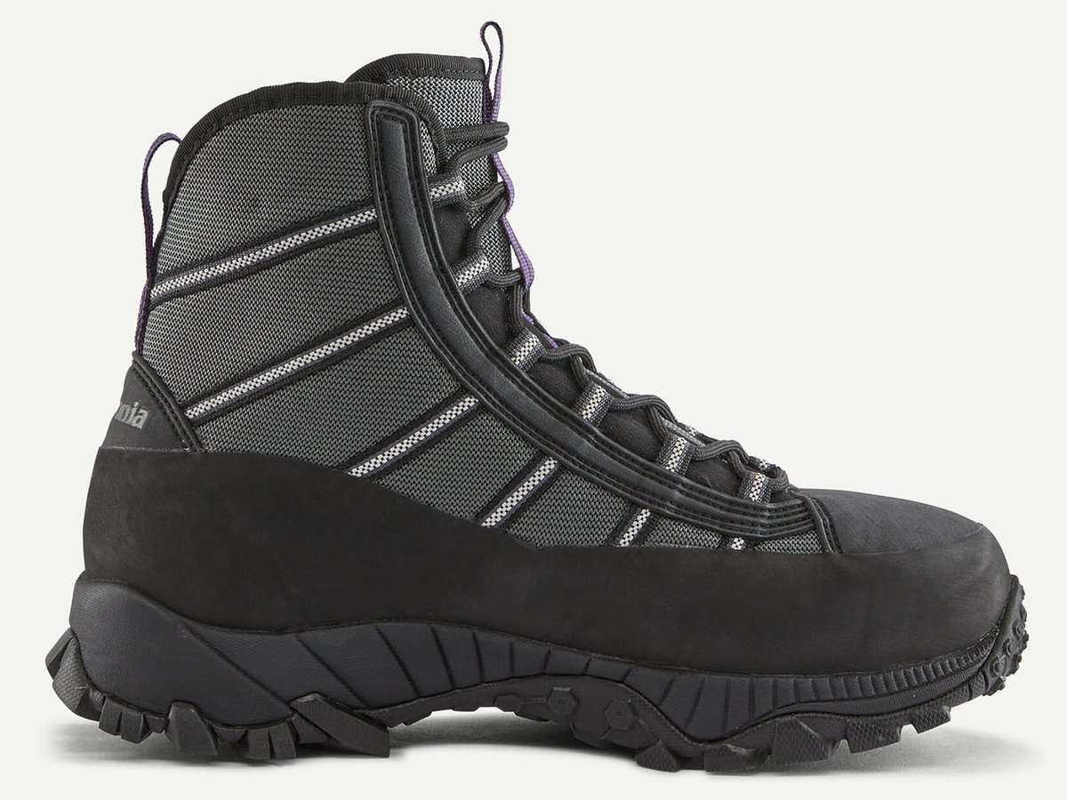 Wide profile of a grey and black Patagonia boot with purple pull tabs, reflective diagonal striping, and lugged black outsole.