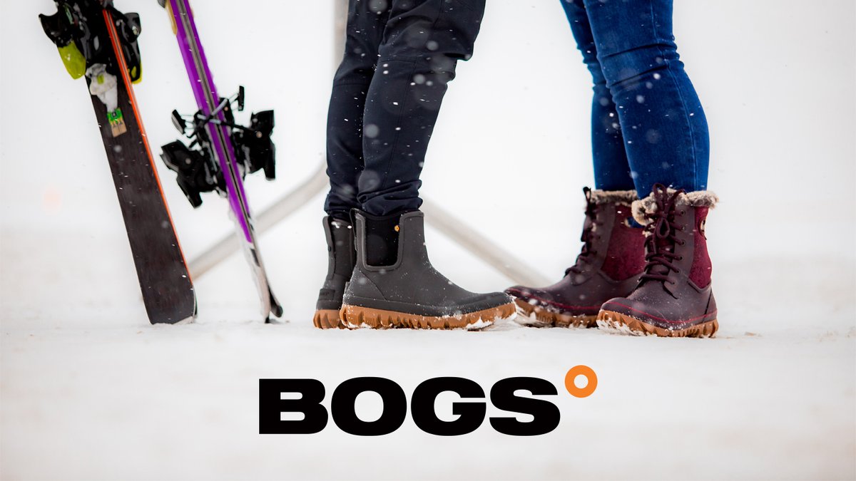 Three people wearing winter boots and snow gear stand together in snowy conditions, showcasing BOGS waterproof insulated boots designed for cold weather outdoor activities.