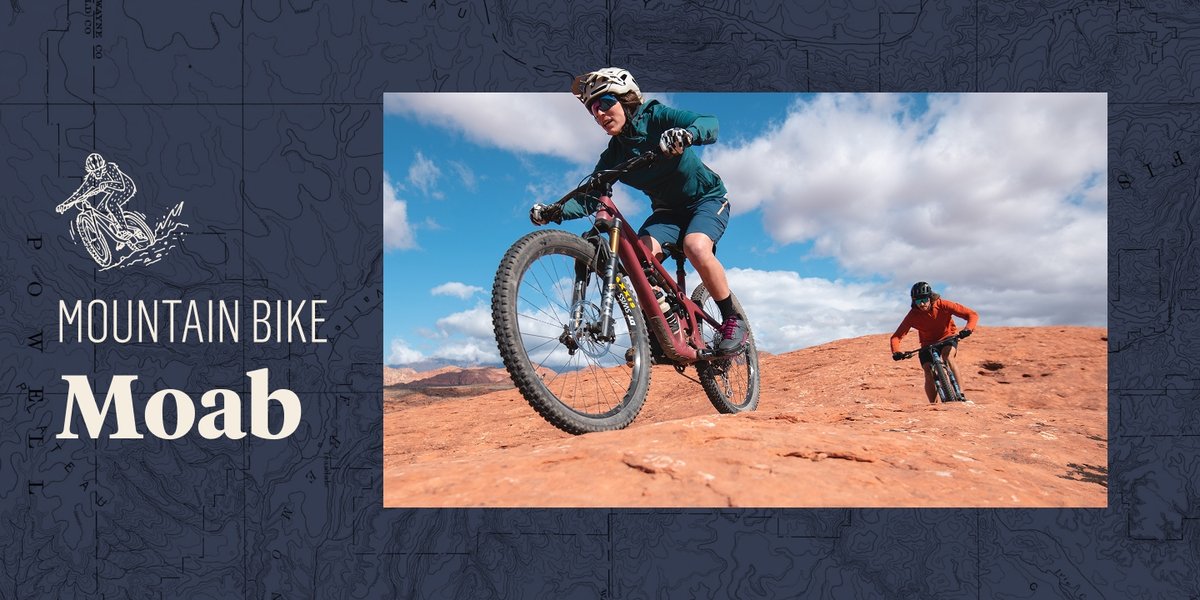 Two people ride mountain bikes over red rocks. The words, “Mountain Bike Moab” appear next to them.