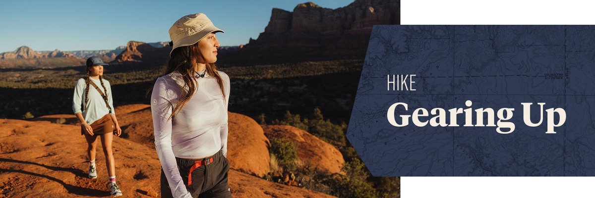 Two people hike on red sandstone. Text overlay reads: Hike Gearing Up