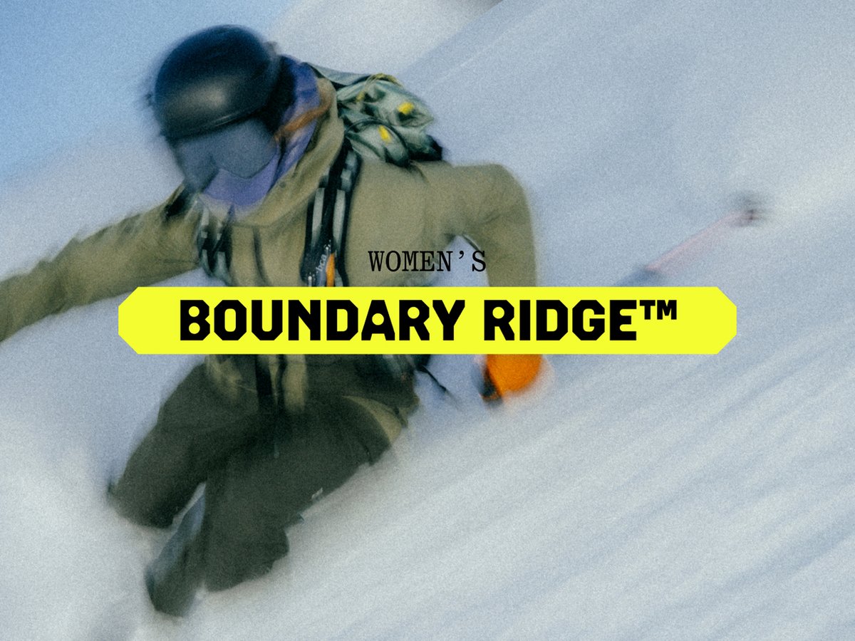 A skier tightens their boots.