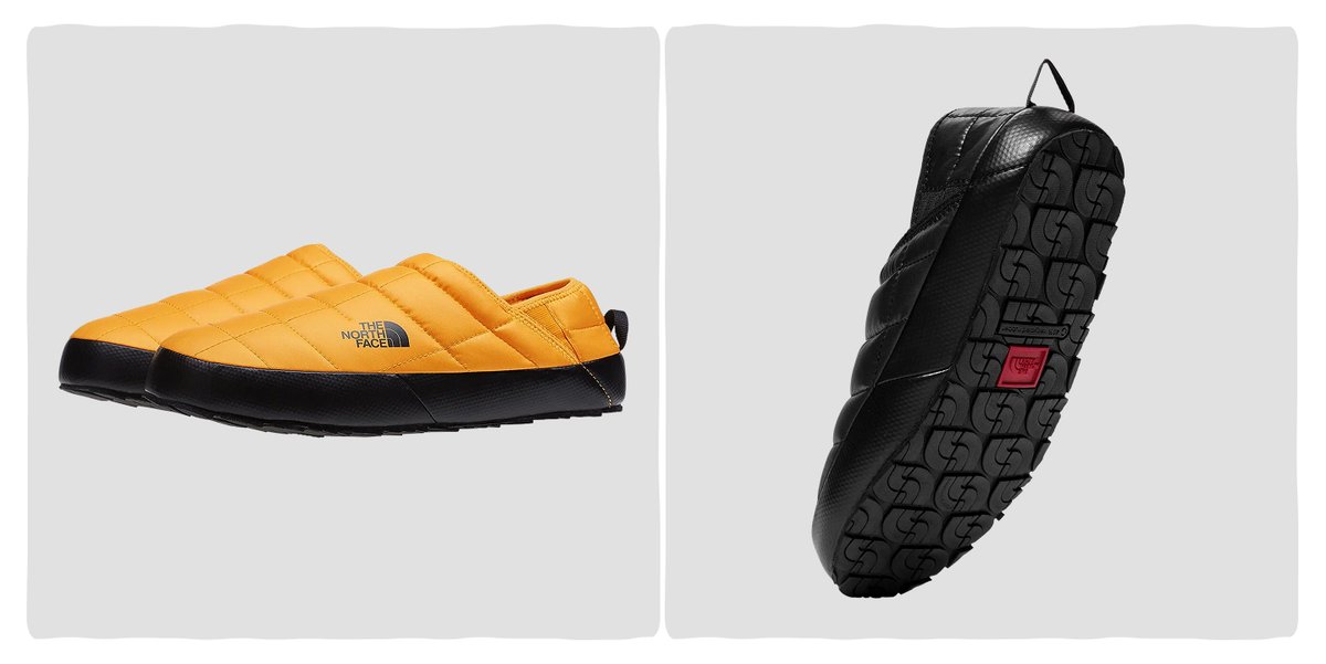 A pair of puffy slippers with rugged rubber soles.