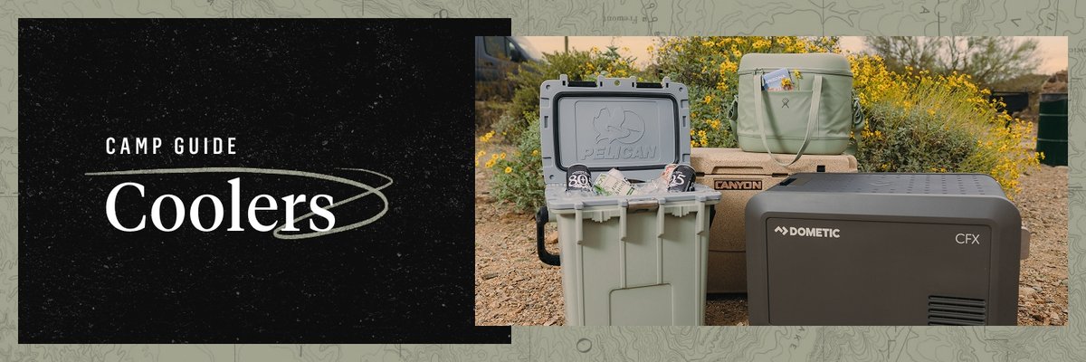 A collection of different coolers sits in a desert environment. Bright yellow flowers bloom behind them. One cooler is open showing beer cans sticking out of ice. Words appear to the left of the coolers saying “Camp Guide, Coolers”.