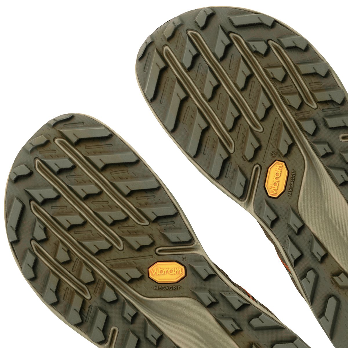 Detail shot of agressive Vibram lugges sole on trail running shoe.