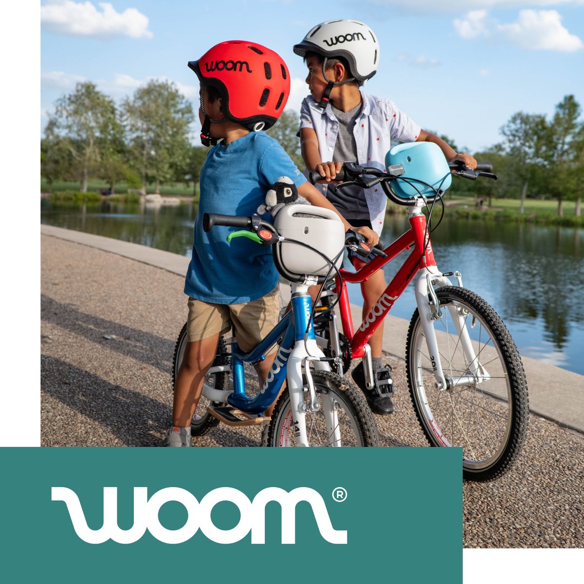 Two kids ride woom bikes.