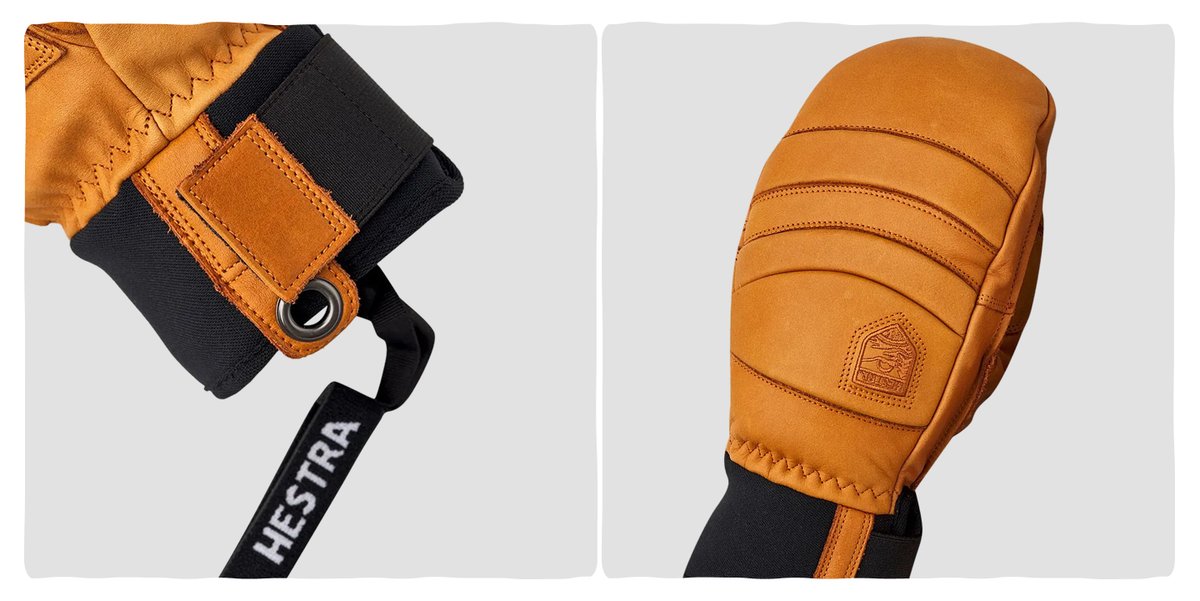A pair of leather mittens with stretch cuffs.