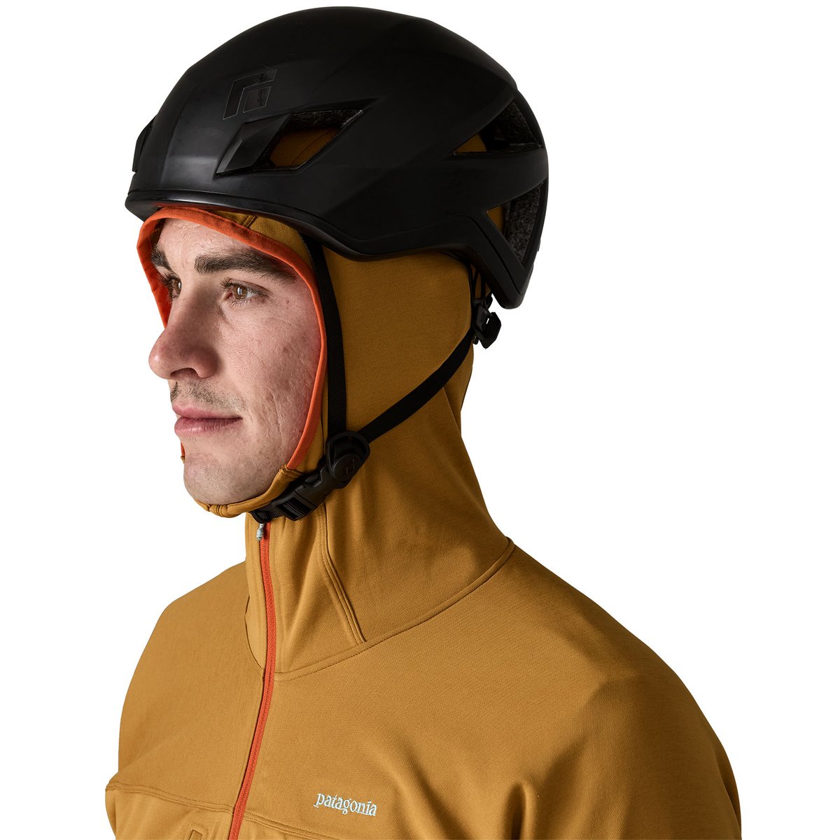Rock climber wearing helmet over Patagonia technical midlayer fleece.