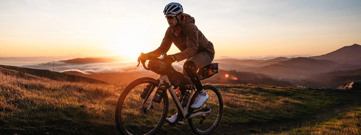 Rider bikepacking on the ENVE MOG carbon gravel bike at sunrise