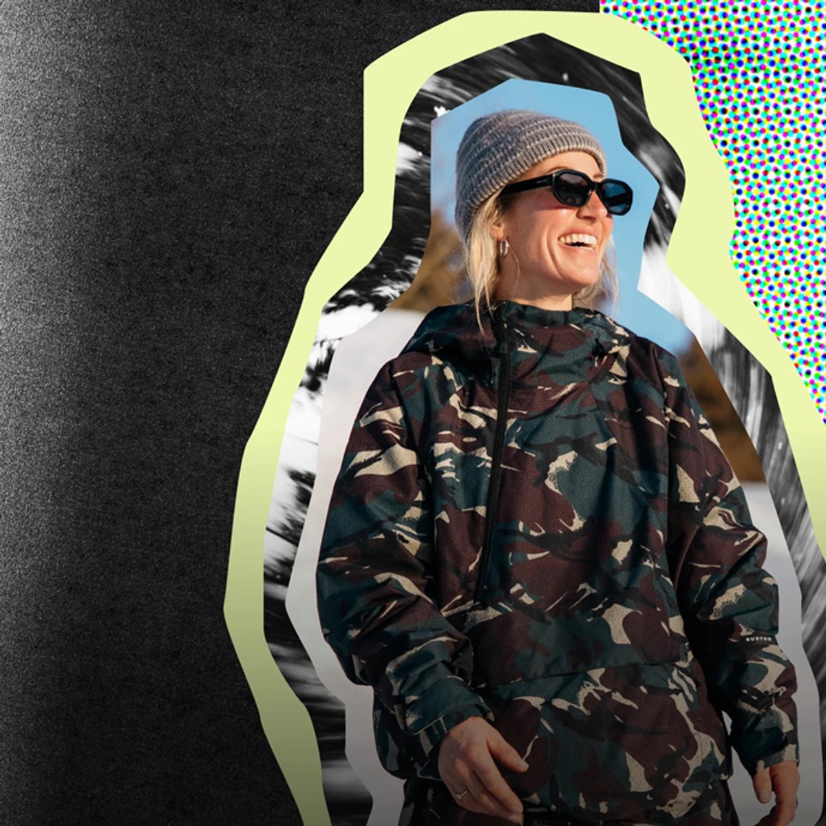 Woman wearing camouflage jacket with beanie and sunglasses smiling outdoors in casual sportswear.