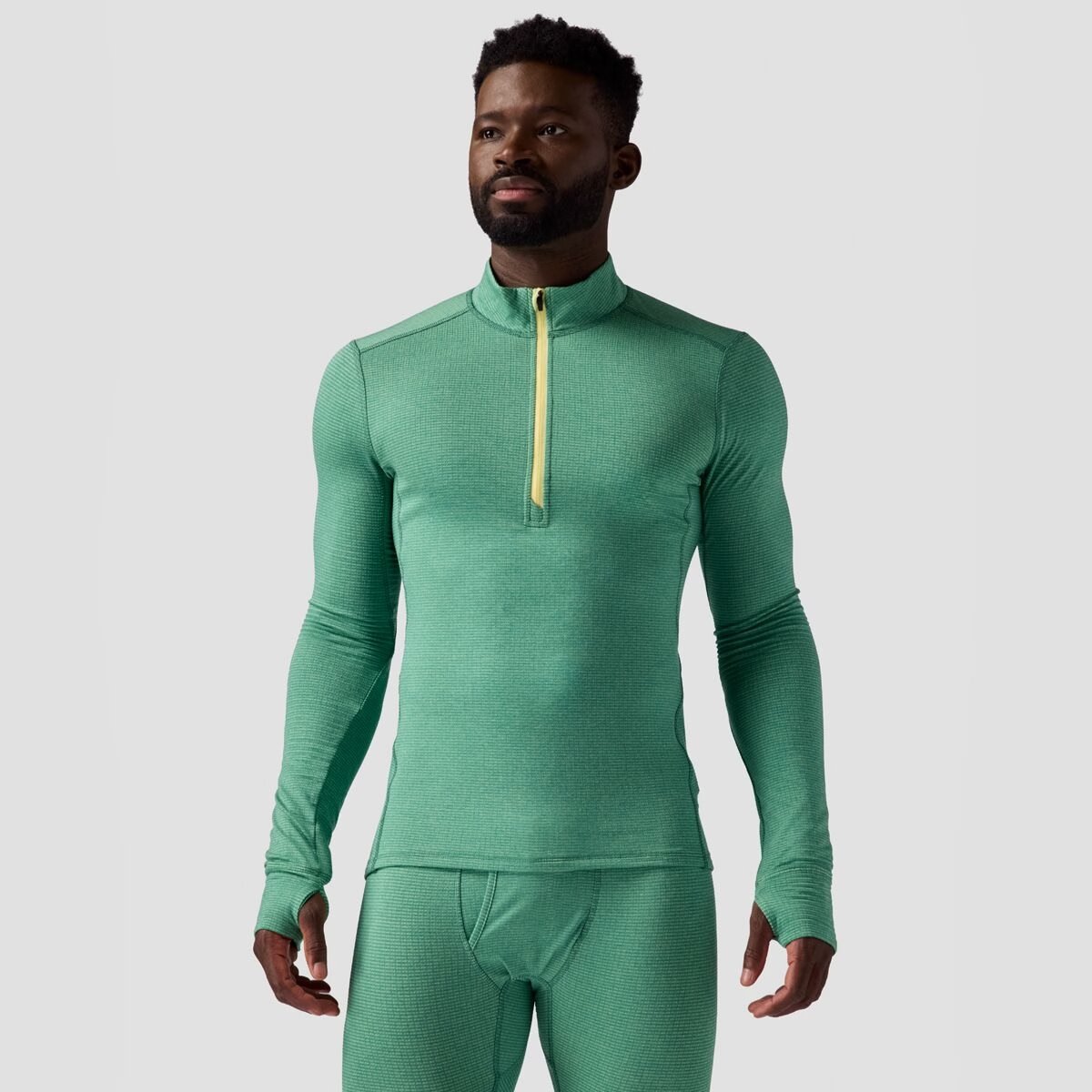 A torso shot of the Pines Men's Half Zip top.