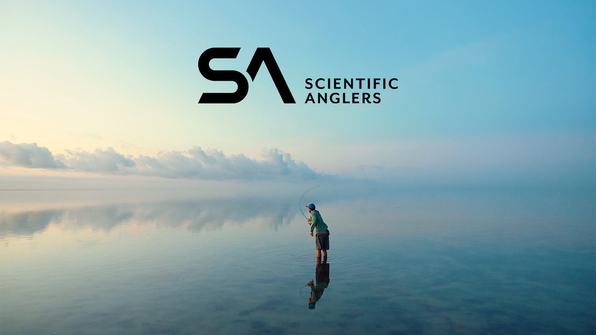 A lone angler in waders casts a fly rod into calm, mirror-like water during early morning light with clouds reflected in the water, showcasing Scientific Anglers fly fishing gear and equipment.