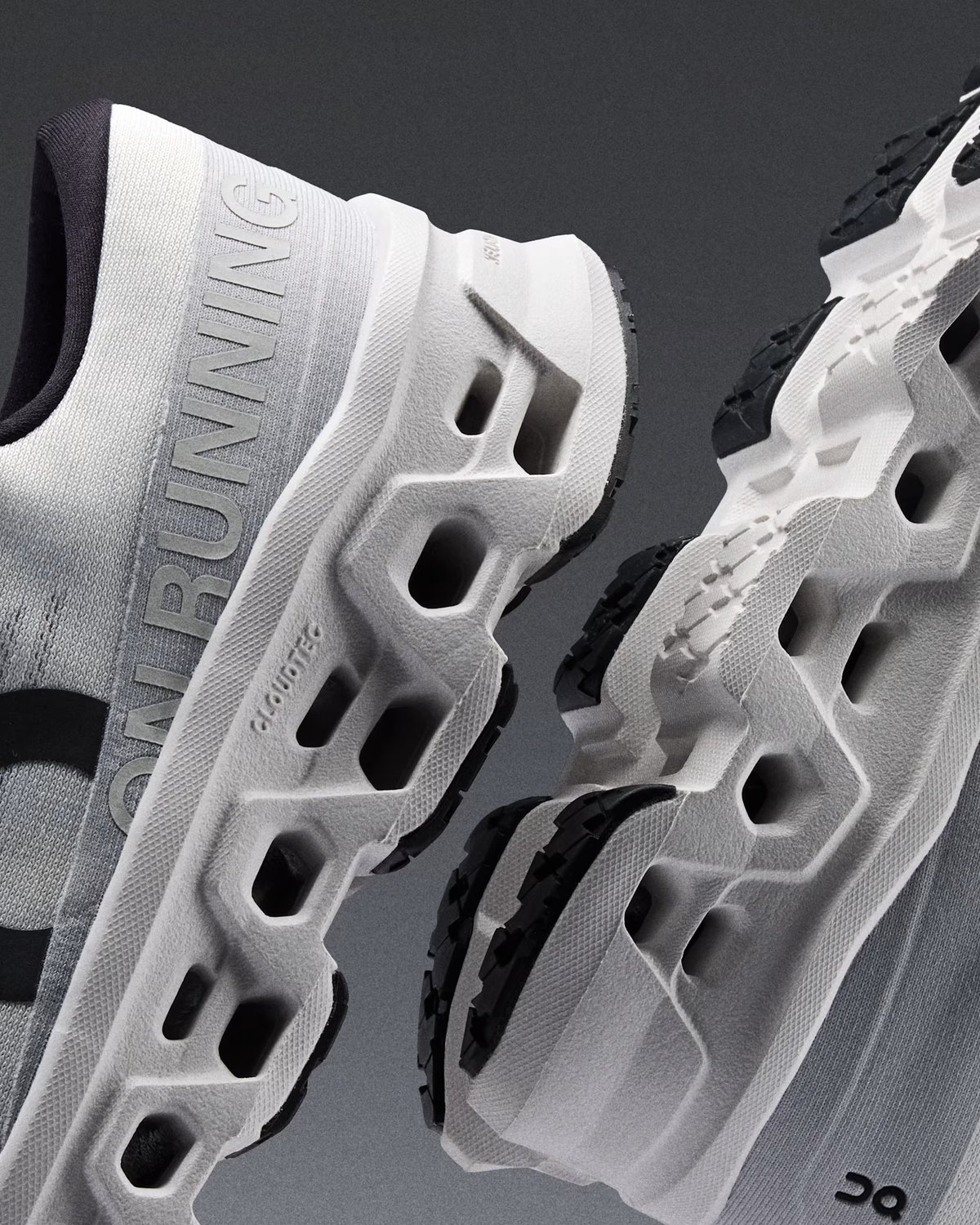 Side profile image of a pair of Cloudmonster 3 shoes.