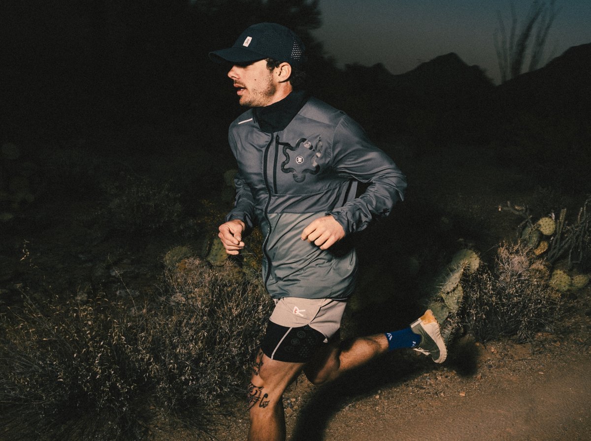 A man runs at night.