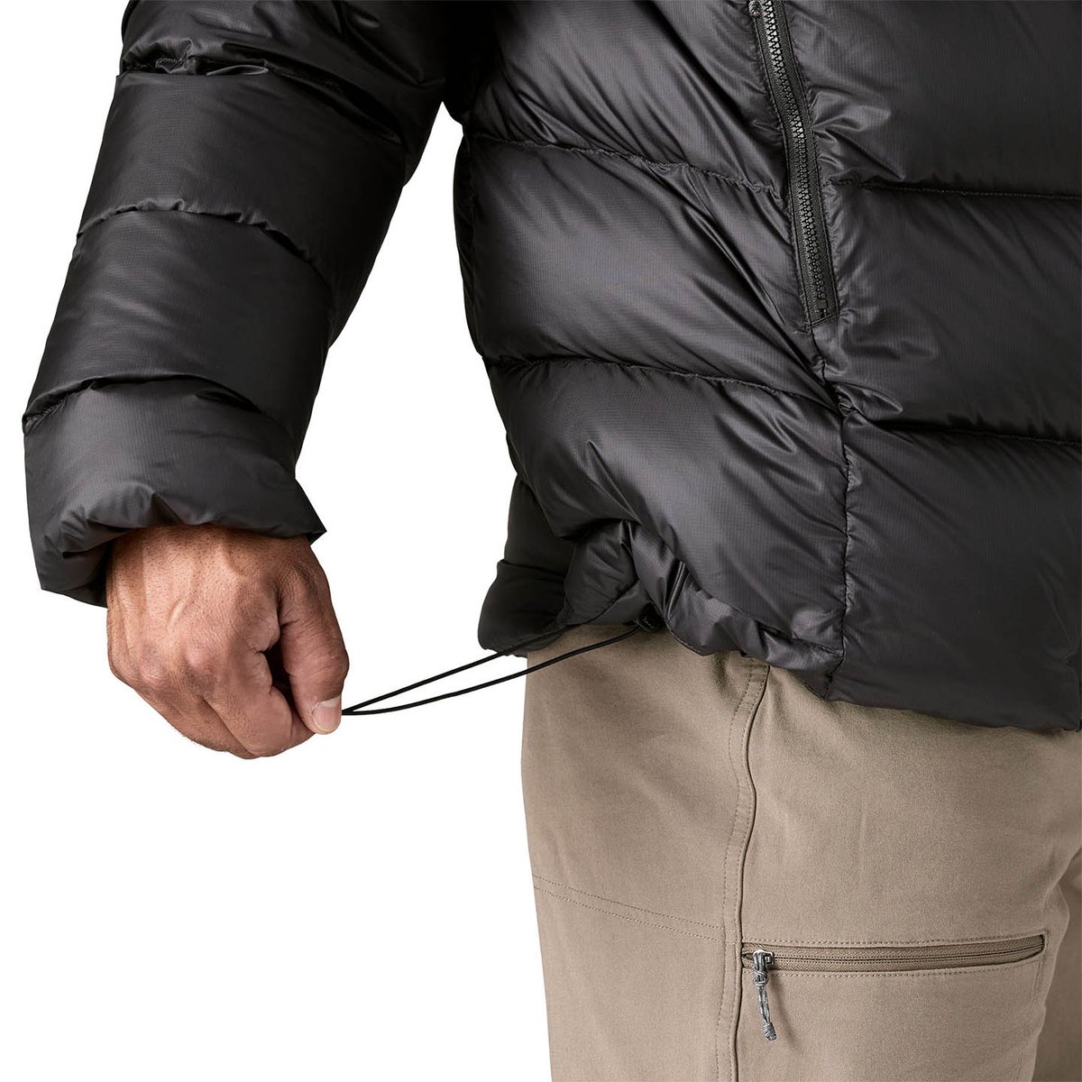 Person wearing black Fitz Roy jacket zipped up and facing forward.
