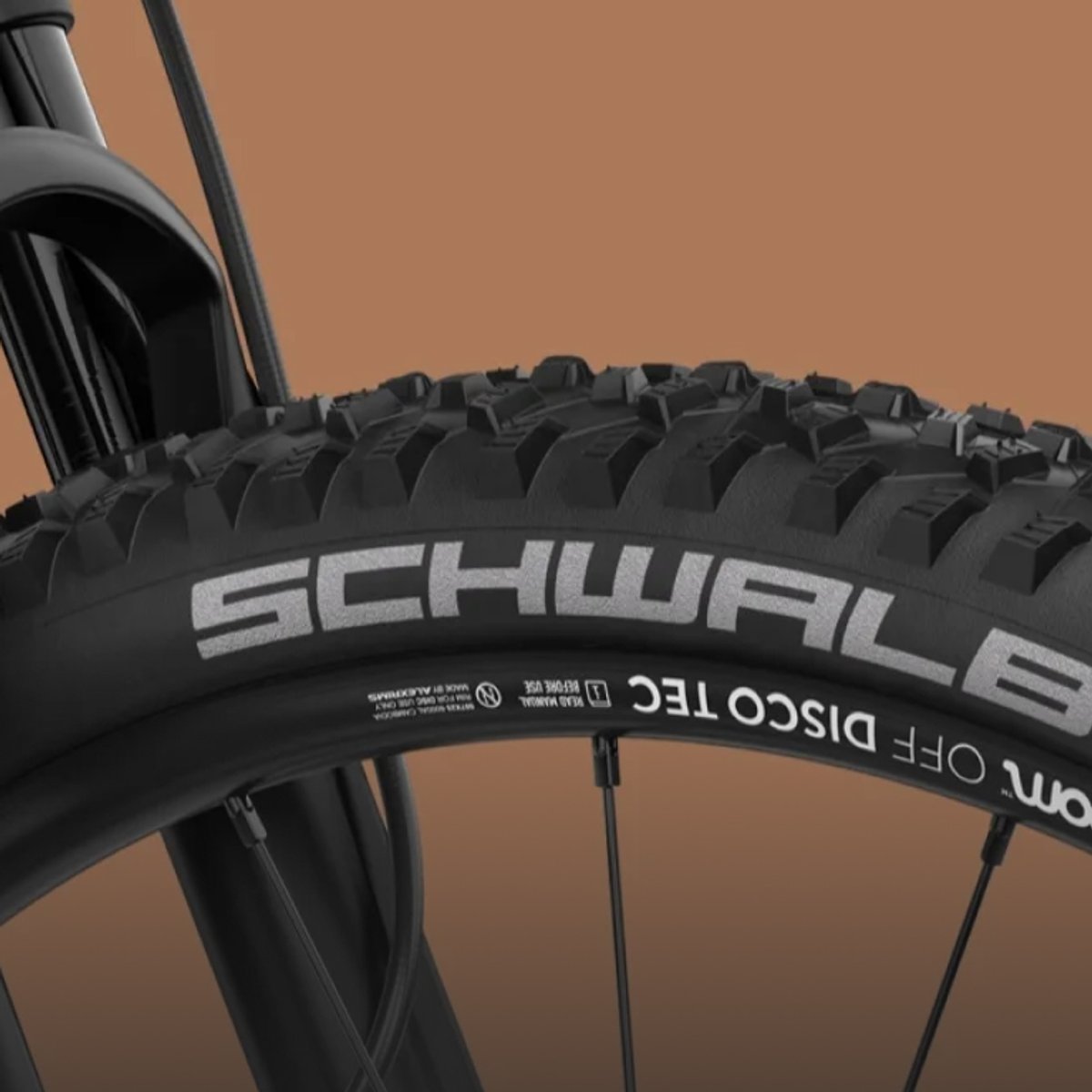 Detail shot of Schwalbe trail tire on Woom Off bike.