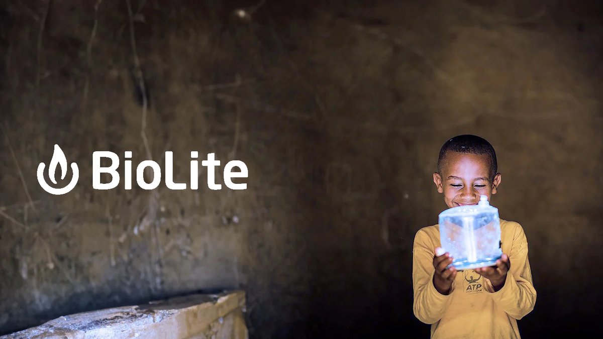 Child holding a glowing BioLite portable light in a dark indoor setting, showcasing the product's bright illumination for emergency preparedness and outdoor adventures.
