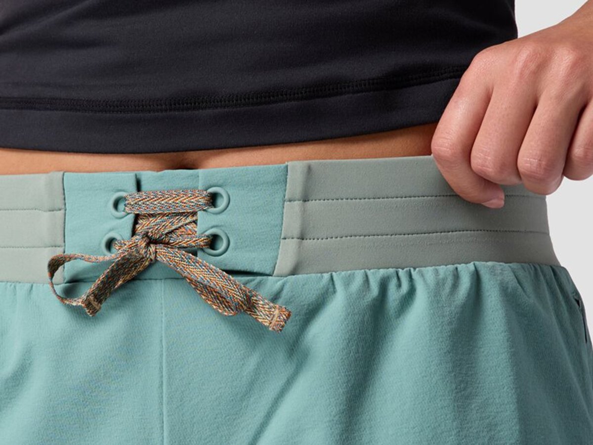 Close-up of wide elastic waistband with drawcord tie.