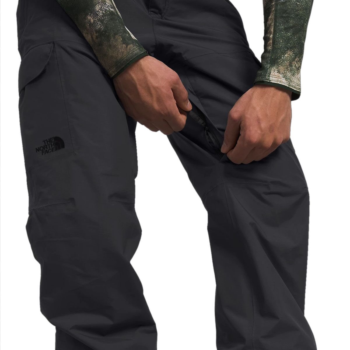 Person unzipping inner thigh vent. 
