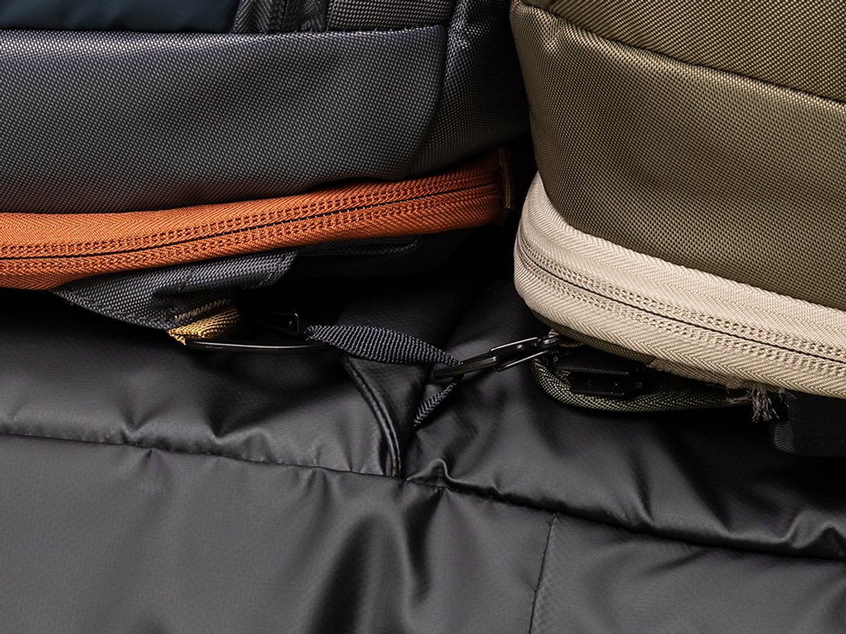 Detail shot of two bags clipped into same webbing loop.