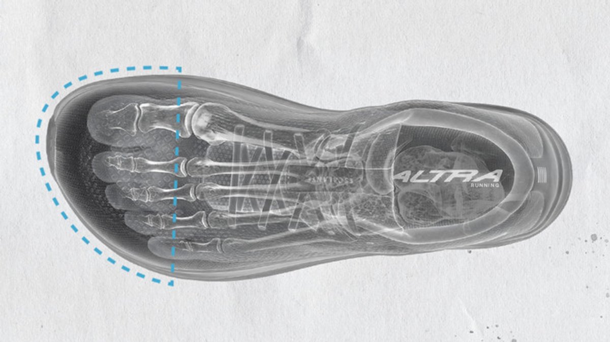 Top down x-ray style image of bone foot inside an Altra shoe with widevtoe box highlighted.