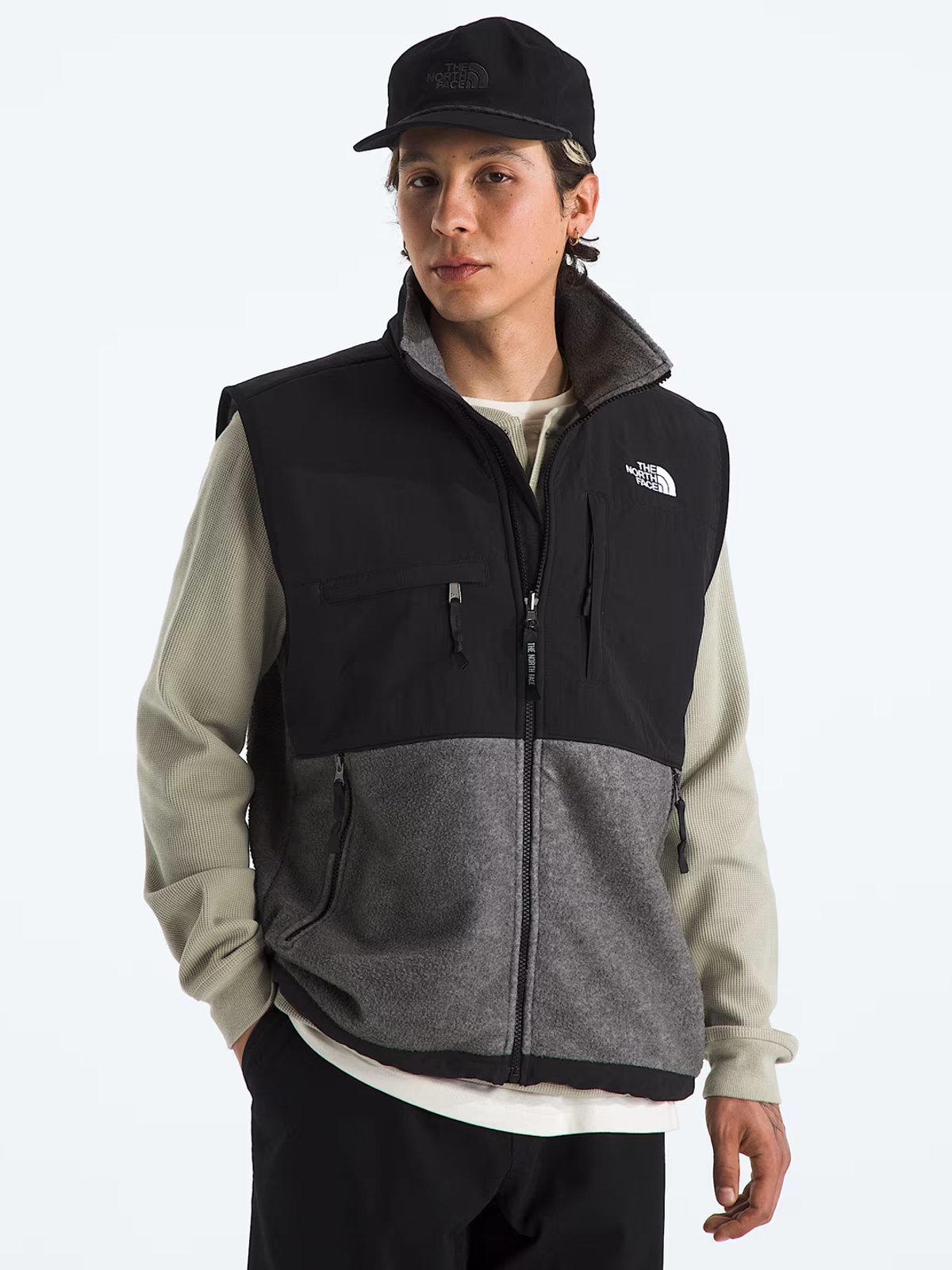 A man wears The North Face full zip vest.