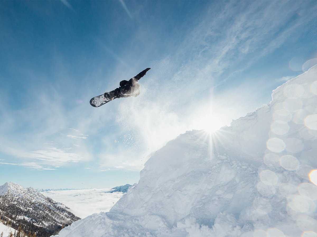 Snowboarder in the air doing a trick.