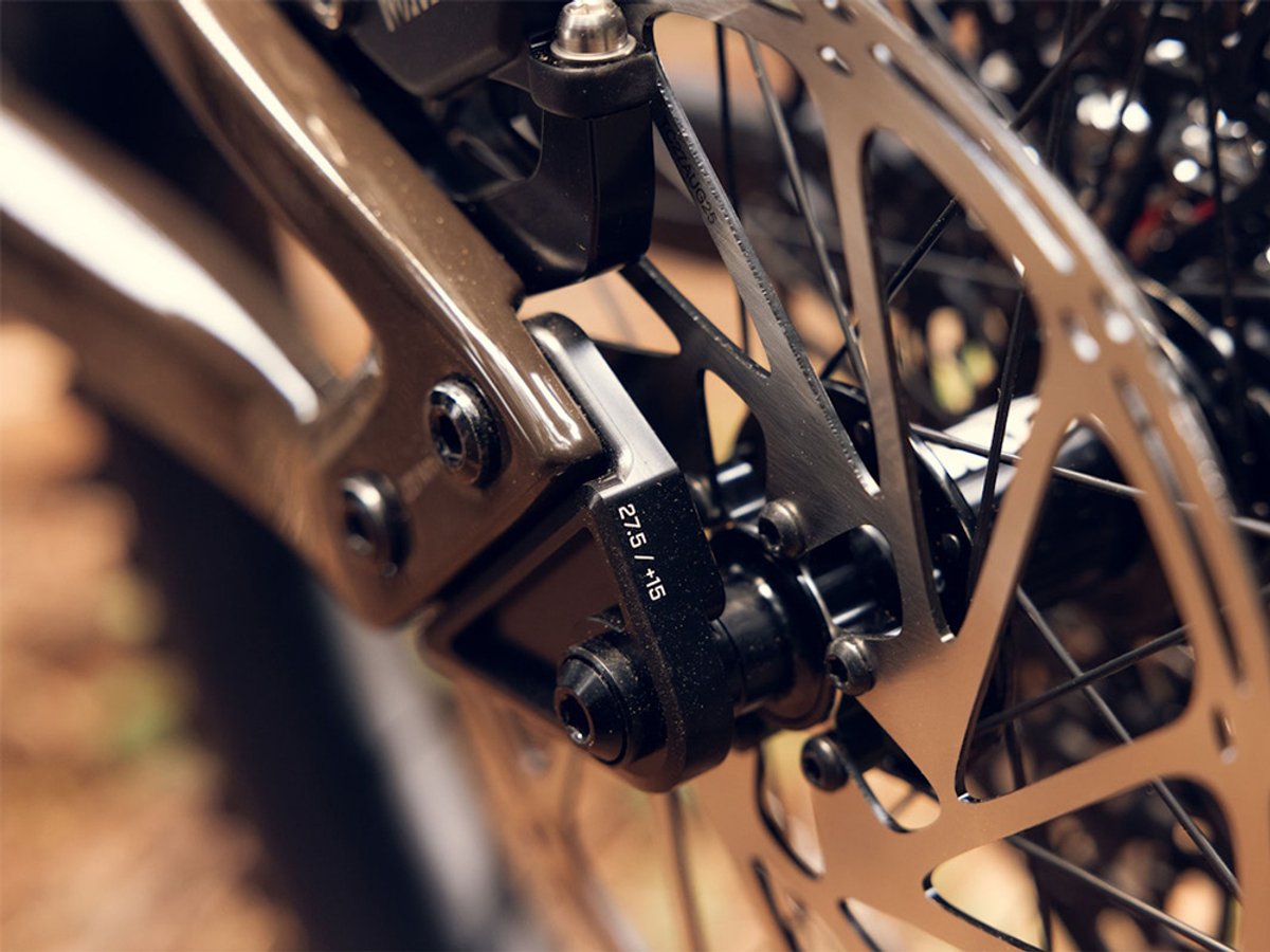 ibis Oso electric mountain bike frame in bronze finish showing bolt-on dropout part