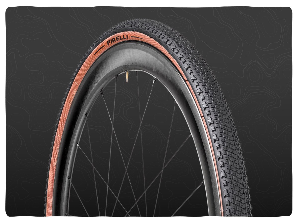 A tire with a file tread pattern pattern and semi knobbed outer tread.