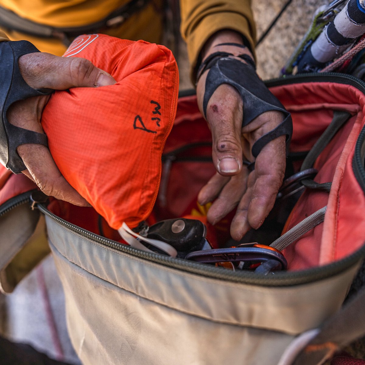 Lightweight Patagonia Houdini Rock Pant packed into thigh stuff pocket and packed into Free Wall Pack.