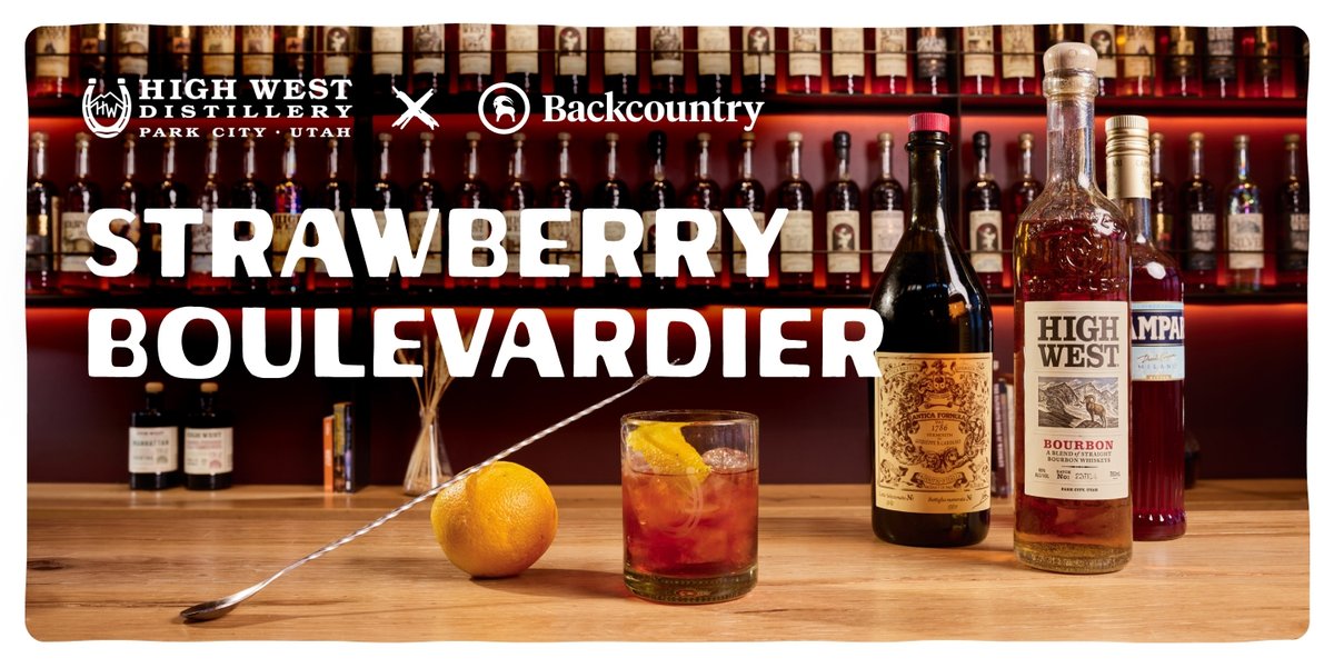 A bar countertop displays ingredients for a Strawberry Boulevardier cocktail: a glass with an orange twist and red drink, an orange, a long stirring spoon, a bottle of High West Bourbon, a bottle of sweet vermouth, and a bottle of Campari, with a background of liquor bottles and large text reading "Strawberry Boulevardier" below the High West Distillery and Backcountry logos.