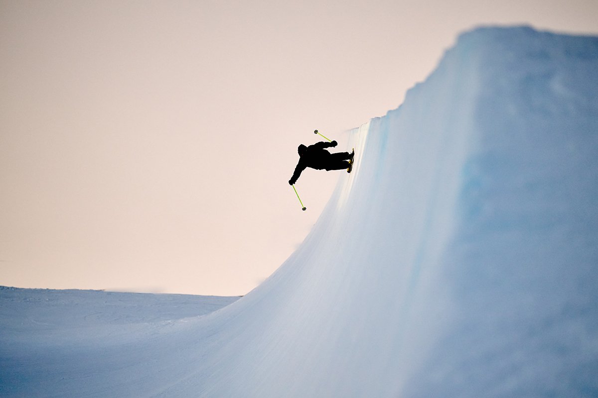 Skier in the half-pipe at sunset