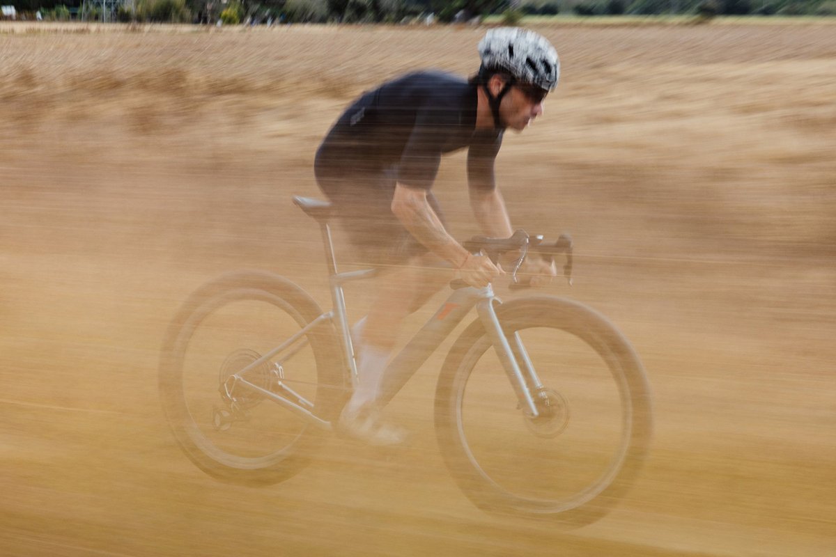 Rider racing trhough a field.